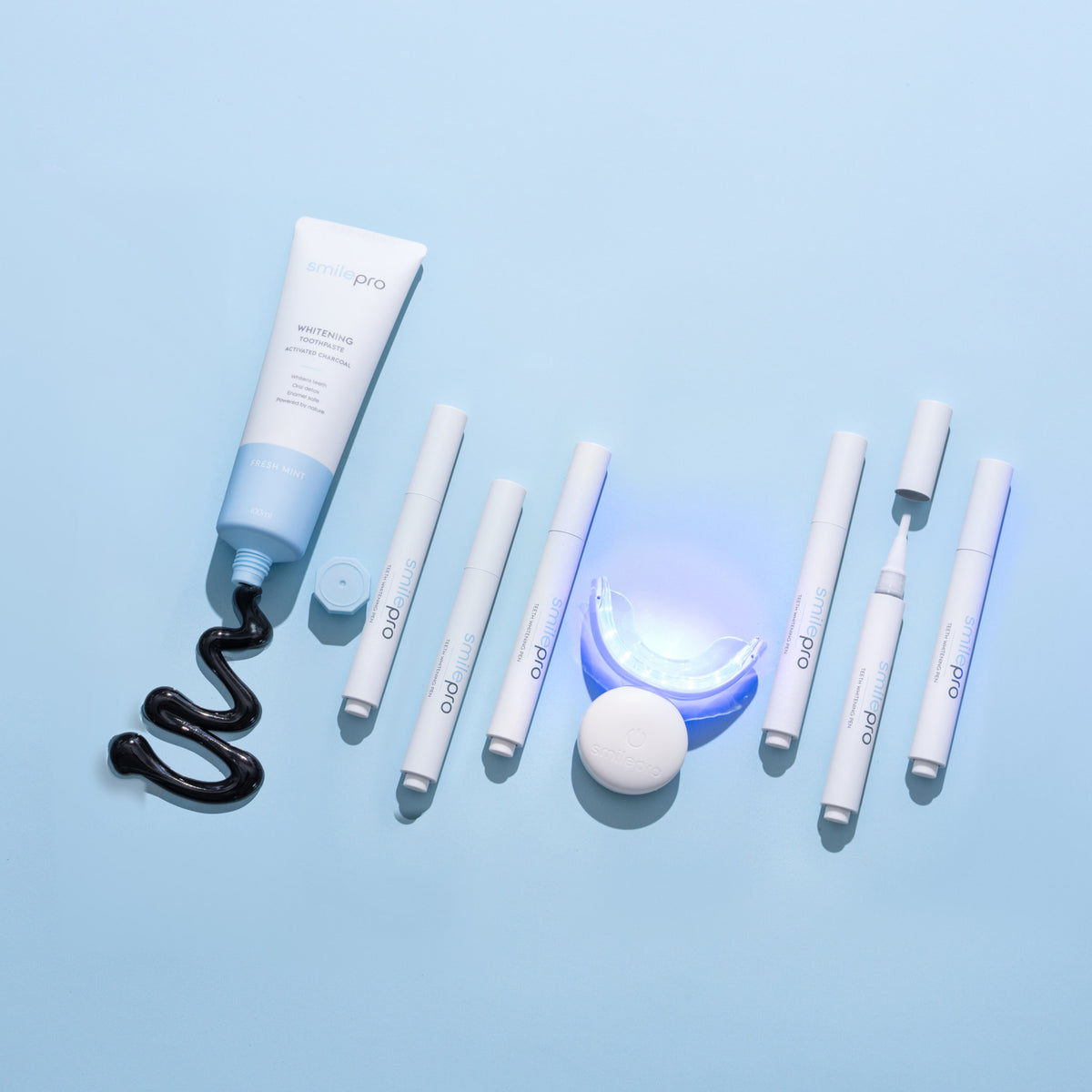 The Ultimate Whitening Set: whitening toothpaste, 6 whitening pens and the LED accelerator light, labelled